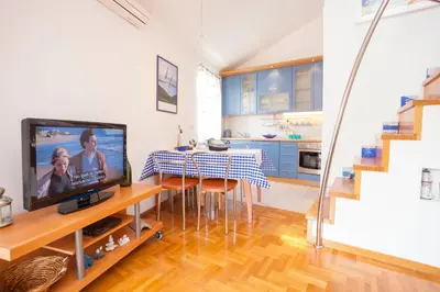 TV i/ili zabavni centar u objektu Apartment Beach