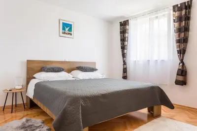 Krevet ili kreveti u jedinici u objektu Apartments Lidija - sea view apartment with exclusive right of using hot tub or split level apartment with exclusive right of using pool