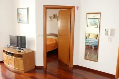 TV i/ili zabavni centar u objektu Apartment Beachfront