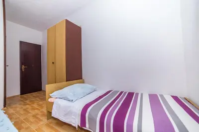 Krevet ili kreveti u jedinici u objektu Apartments and Rooms Drpić