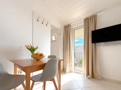 TV i/ili zabavni centar u objektu Beach Resort Apartments Bucina