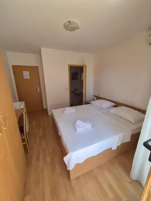 Krevet ili kreveti u jedinici u objektu Apartments and Rooms Mamić