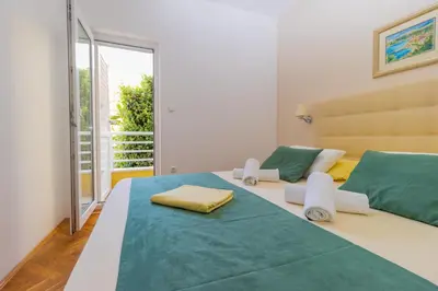 Krevet ili kreveti u jedinici u objektu Luxury Apartments Villa Ruzmarina with New heated Infinity Pool and Lounge Area