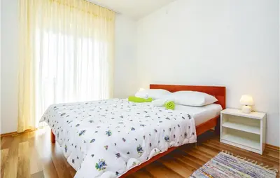 Krevet ili kreveti u jedinici u objektu Three-Bedroom Apartment In Mali Rat