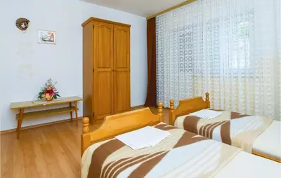 Krevet ili kreveti u jedinici u objektu Four-Bedroom Apartment In Omis