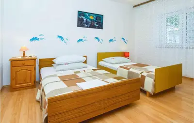 Krevet ili kreveti u jedinici u objektu Four-Bedroom Apartment In Omis