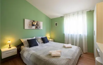 Krevet ili kreveti u jedinici u objektu Three-Bedroom Apartment In Ostrvica