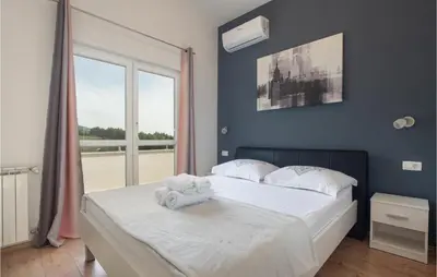 Krevet ili kreveti u jedinici u objektu Two-Bedroom Apartment In Podstrana