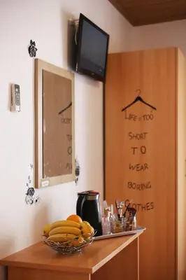 TV i/ili zabavni centar u objektu Apartment & Rooms Marigold