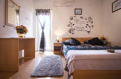 Krevet ili kreveti u jedinici u objektu Apartment & Rooms Marigold