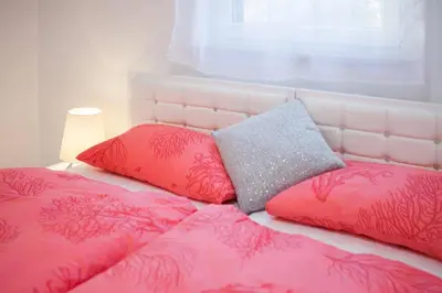 Krevet ili kreveti u jedinici u objektu La Perla Apartments