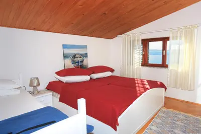 Krevet ili kreveti u jedinici u objektu Apartments by the sea Stanici, Omis - 12723
