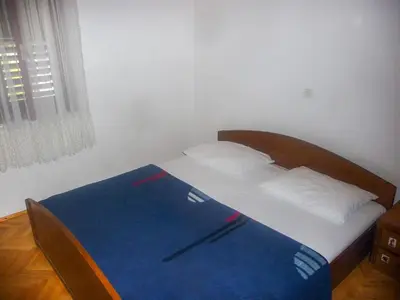 Krevet ili kreveti u jedinici u objektu Apartments by the sea Stanici, Omis - 12723
