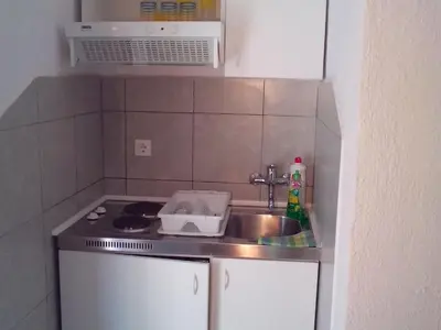 Kuhinja ili čajna kuhinja u objektu Apartments Neda