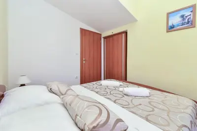 Krevet ili kreveti u jedinici u objektu Apartments Bogdan