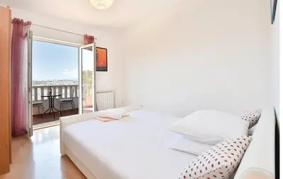 Krevet ili kreveti u jedinici u objektu Family friendly apartments with a swimming pool Podstrana, Split - 13828