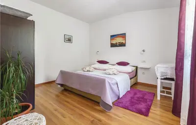Krevet ili kreveti u jedinici u objektu One-Bedroom Apartment In Ostrvica
