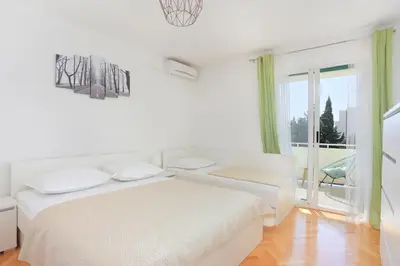 Krevet ili kreveti u jedinici u objektu Apartments by the sea Makarska - 13222