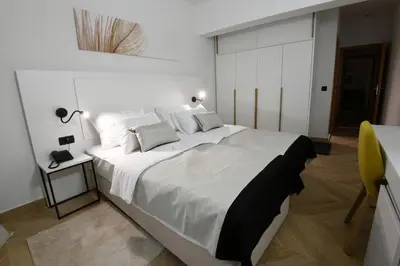 Krevet ili kreveti u jedinici u objektu Aparthotel Milenij