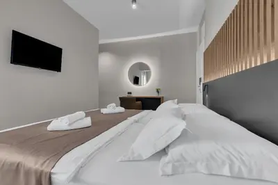 Krevet ili kreveti u jedinici u objektu Beach Hotel Božikovina