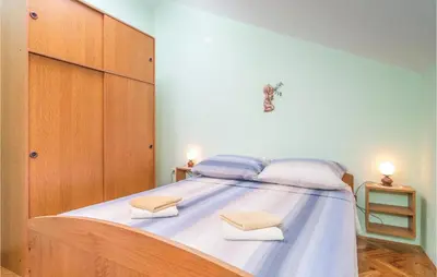 Krevet ili kreveti u jedinici u objektu Three-Bedroom Holiday Home In Sutivan