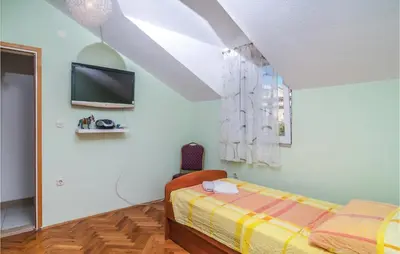 Krevet ili kreveti u jedinici u objektu Three-Bedroom Holiday Home In Sutivan