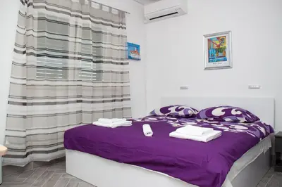 Krevet ili kreveti u jedinici u objektu Apartments by the sea Krilo Jesenice, Omis - 14459