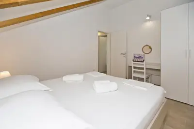 Krevet ili kreveti u jedinici u objektu Apartments and Rooms Zvjezdana