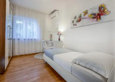 Krevet ili kreveti u jedinici u objektu VILLA ARYA - Heated pool, roof hot tub, gym, near the beach with amazing views!