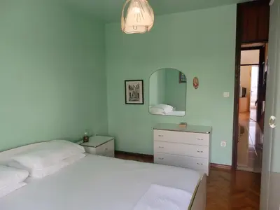 Krevet ili kreveti u jedinici u objektu Holiday apartment with a balcony and sea view, just 300 metres from the beach