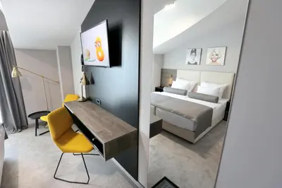 Krevet ili kreveti u jedinici u objektu Hotel Milenij
