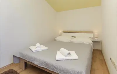 Krevet ili kreveti u jedinici u objektu Three-Bedroom Apartment In Donja Ostrvica