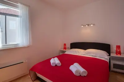 Krevet ili kreveti u jedinici u objektu APARTMENTS BRUNO 1&2 - two-room penthouse apartments - wonderful panoramic view of the sea - the best location, first row to the beach - 10 minutes from Supetar ferry port - free secured parking - facilities nearby