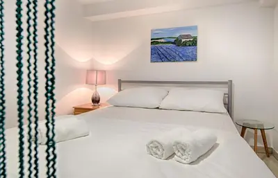 Krevet ili kreveti u jedinici u objektu Cezar Luxury Apartment