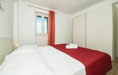 Krevet ili kreveti u jedinici u objektu Three-Bedroom Holiday Home In Stanici