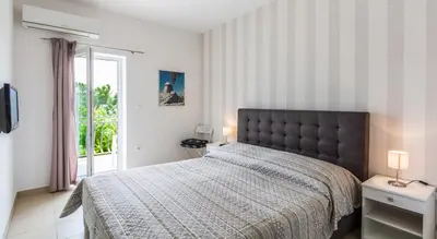 Krevet ili kreveti u jedinici u objektu Rooms & Apartments Bruno