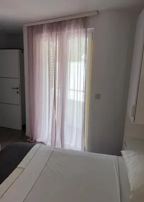 Krevet ili kreveti u jedinici u objektu Baška Voda Apartman Nino