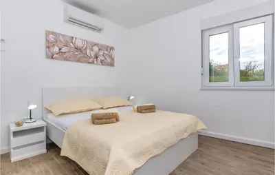 Krevet ili kreveti u jedinici u objektu Lovely Home In Srinjine