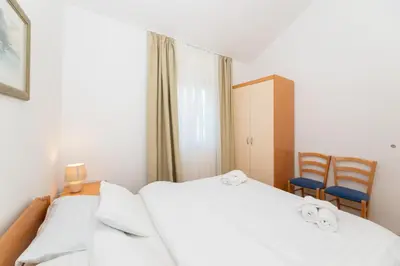Krevet ili kreveti u jedinici u objektu APARTMENTS JELENA 1,2,3,4 & 5 SUPETAR - free parking