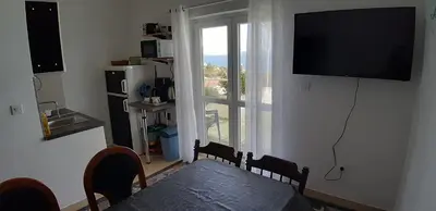 TV i/ili zabavni centar u objektu Apartmani Marijana