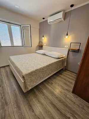 Krevet ili kreveti u jedinici u objektu Apartmani Nikmar