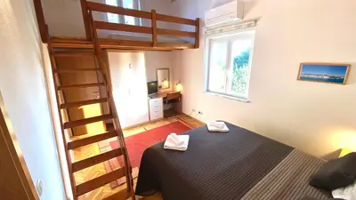 Krevet ili kreveti u jedinici u objektu Nautilus-Bay Holiday home with 5 rooms, on the beach, for 2-9 persons