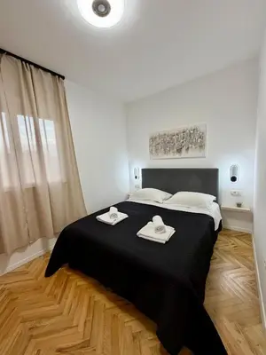 Krevet ili kreveti u jedinici u objektu Apartments & Rooms Prižmić Split