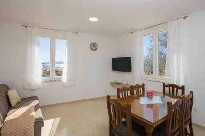 TV i/ili zabavni centar u objektu Sandy Beach Apartment