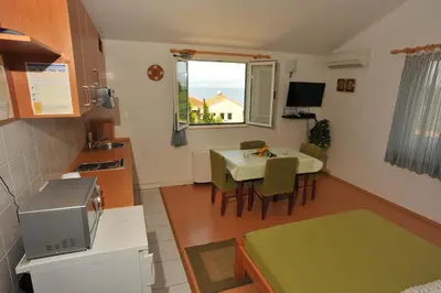 TV i/ili zabavni centar u objektu Seaside apartments with a swimming pool Sutivan, Brac - 16846