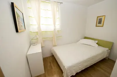 Krevet ili kreveti u jedinici u objektu Apartments by the sea Promajna, Makarska - 17160
