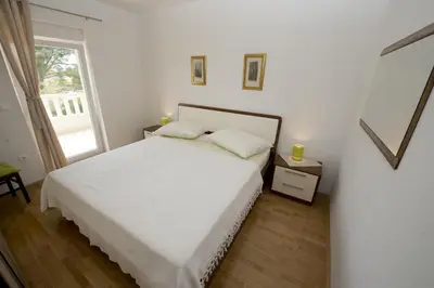 Krevet ili kreveti u jedinici u objektu Apartments by the sea Promajna, Makarska - 17160