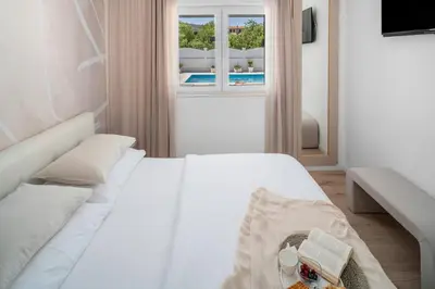 Krevet ili kreveti u jedinici u objektu VILLA TUGARKA private pool, fitness, play-house, great for families, max 6 per.