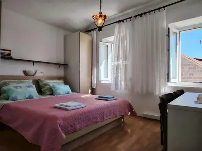 Krevet ili kreveti u jedinici u objektu Apartments - 3 A beautiful apartment with a sea view