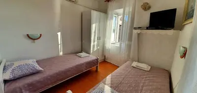 Krevet ili kreveti u jedinici u objektu Apartments - 3 A beautiful apartment with a sea view